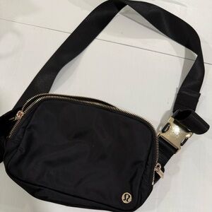 Excellent almost new Lululemon 2L black with gold color hardware Crossbody